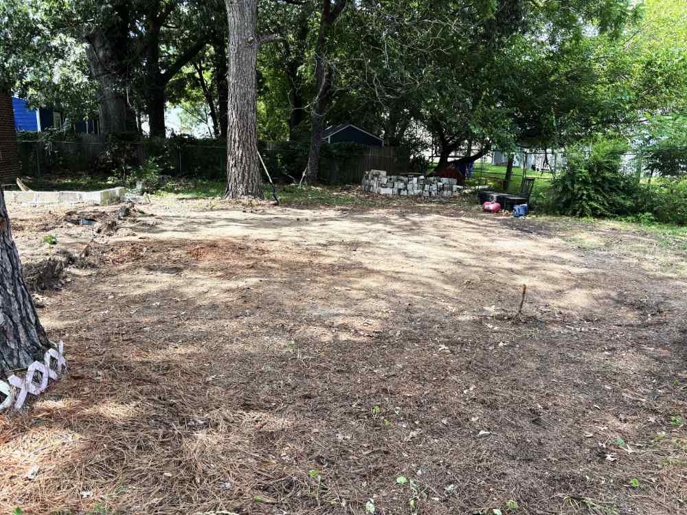 Cleared residential lot after shed demolition and site cleanup ready for new construction.